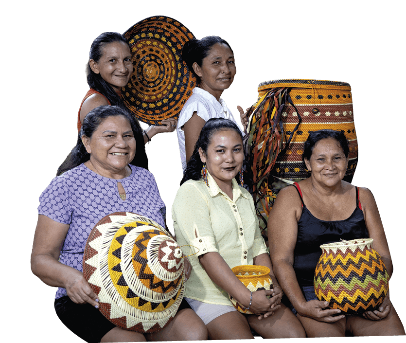 A group of women sitting on a bench holding baskets. Description generated by AI