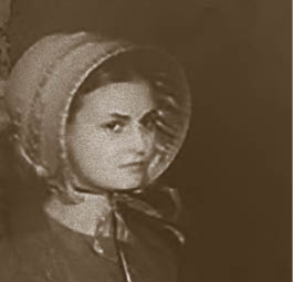 A woman wearing a bonnet and dress. Description generated by AI