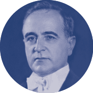 A man wearing a white shirt and a black suit. Description generated by AI